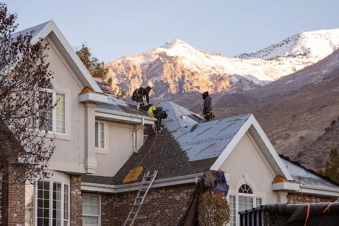 several roofing contractors from Aesthetic Roofing working on a residential roofing project in Salt Lake County, UT